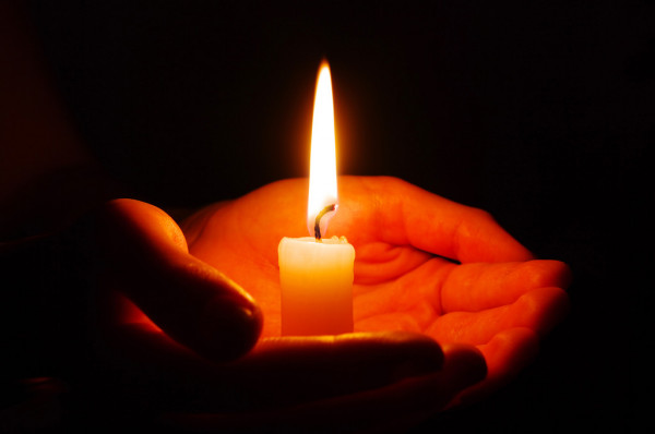 depositphotos_7301433-stock-photo-candle-in-a-hand